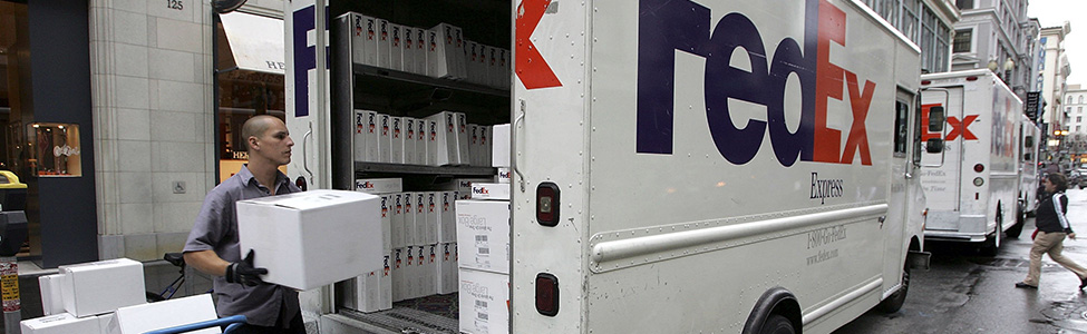 FedEx employee loading truck