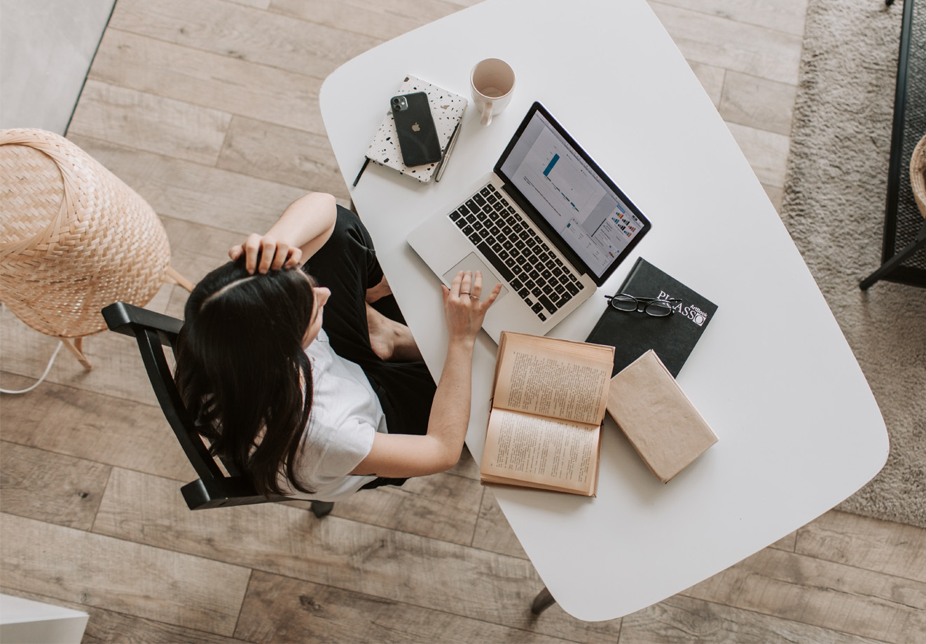 Woman sitting at table with laptop