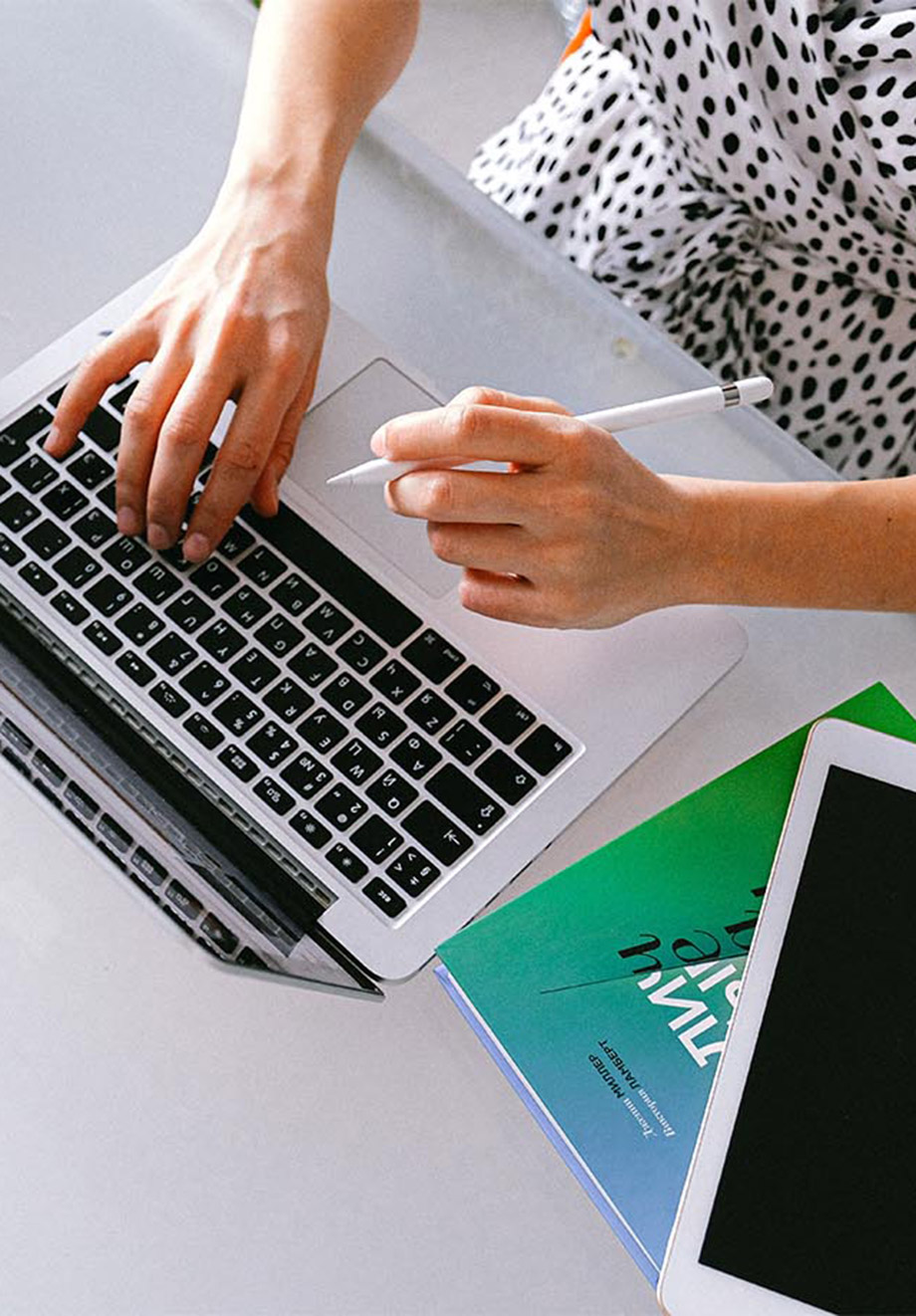 ariel view of person working on laptop at their desk