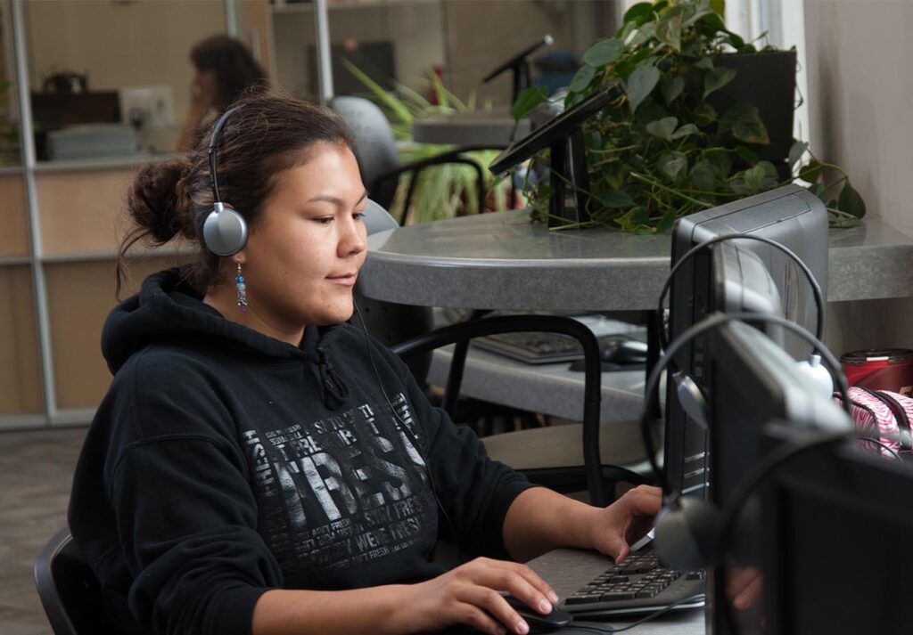 SIIT Student working at a computer