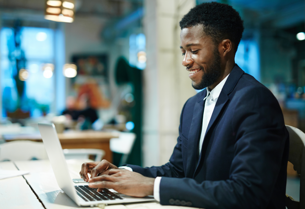 Man in business suit working on laptop