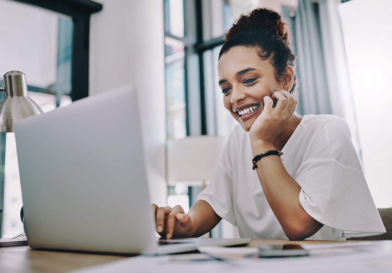 Woman working on laptop at desk