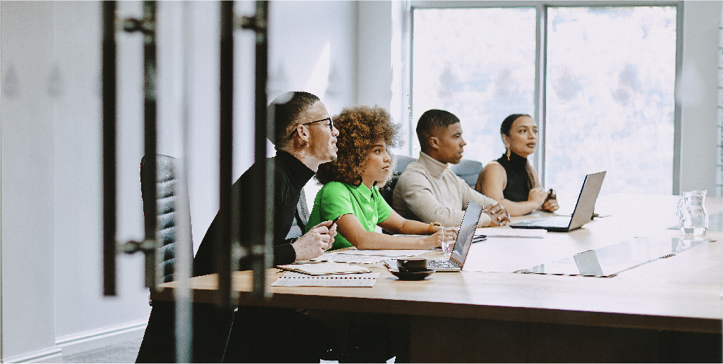 People sitting in a boardroom.