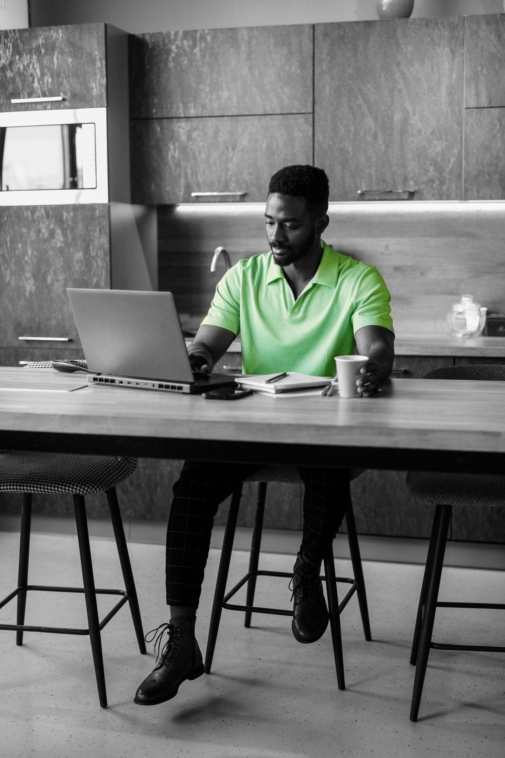 Man working on laptop at a desk in an office